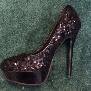 Black sequin pumps